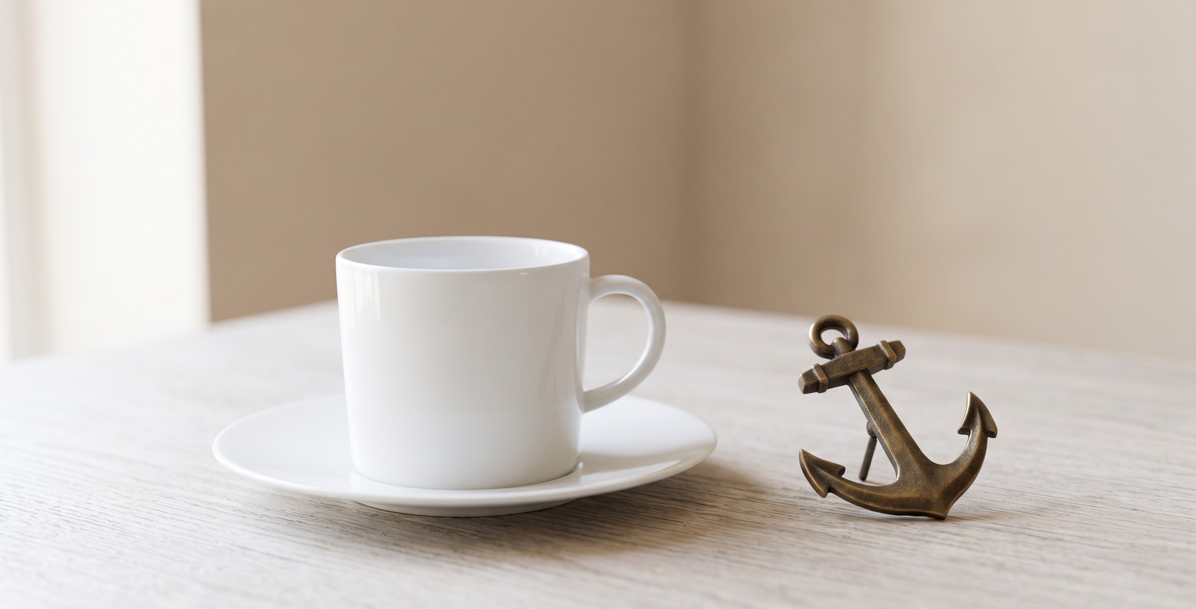 A teacup beside a ship anchor, still life representing waiting versus commitment