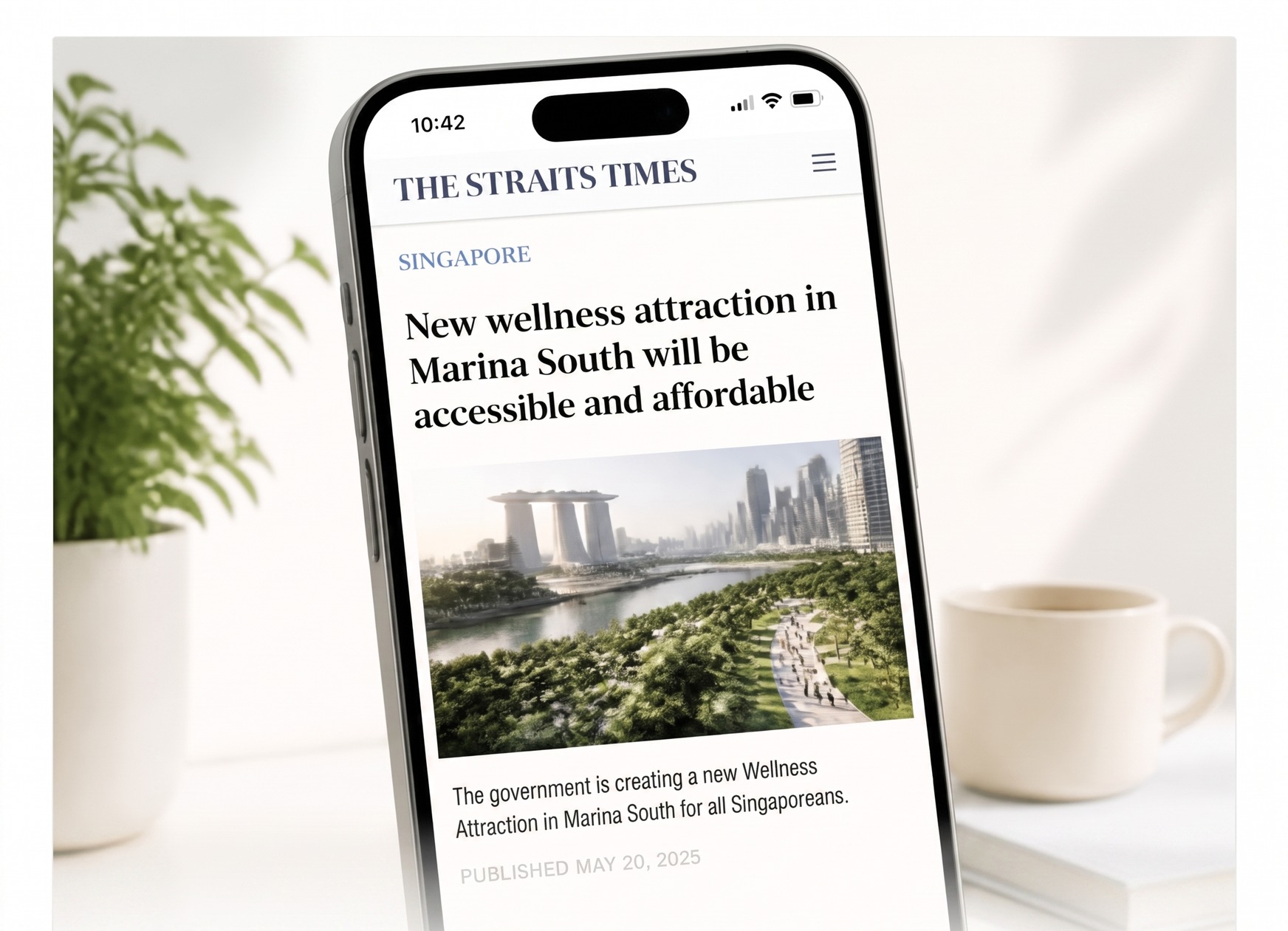 A phone displaying coverage of the Marina South wellness attraction announcement